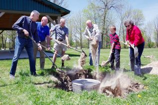Everyone who was on hand took a turn filling in the hole to cover up the capsule. Photo Paul Wash